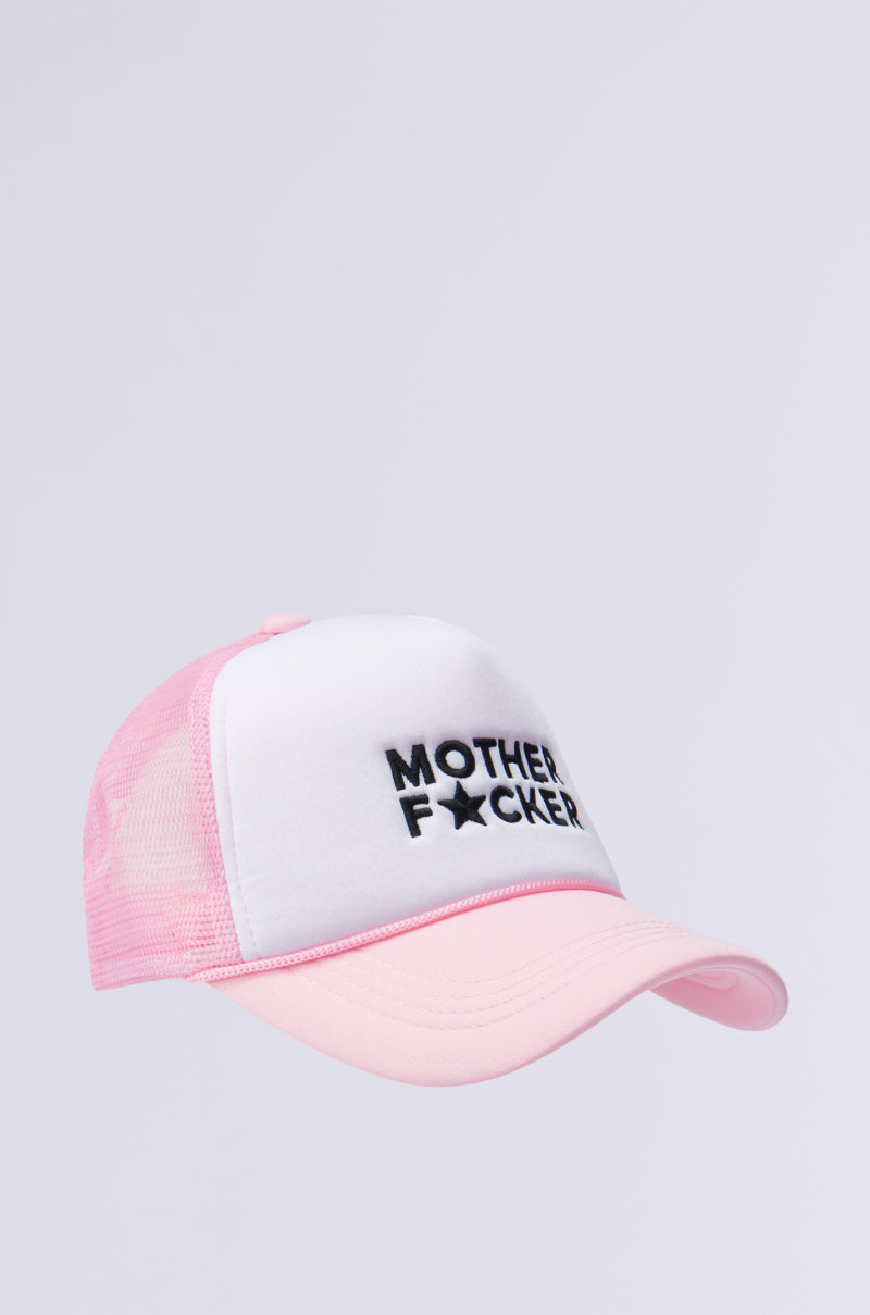 The MOTHER TRUCKER HAT IN PINK is a pink and white trucker hat featuring a light grey front panel with the embroidered text "Mother F*cker," where the "U" is replaced by a star symbol. It comes with a mesh back and an adjustable snapback closure.