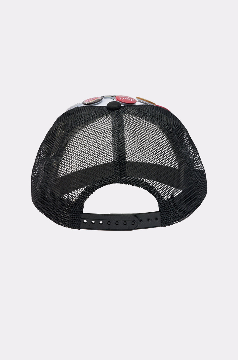 The LOVE ME BUTTON HAT is a black mesh-back cap shown from the back, featuring an adjustable snapback closure for a comfortable fit.