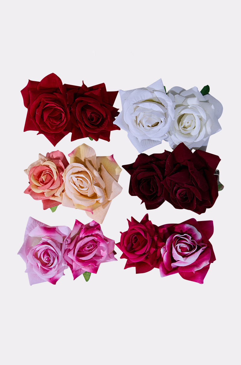 Six pairs of ROSES ARE RED HAIR CLIPS in red, white, peach, burgundy, light pink, and bright pink are arranged in two vertical columns on a white background—ideal floral accessories for any occasion.
