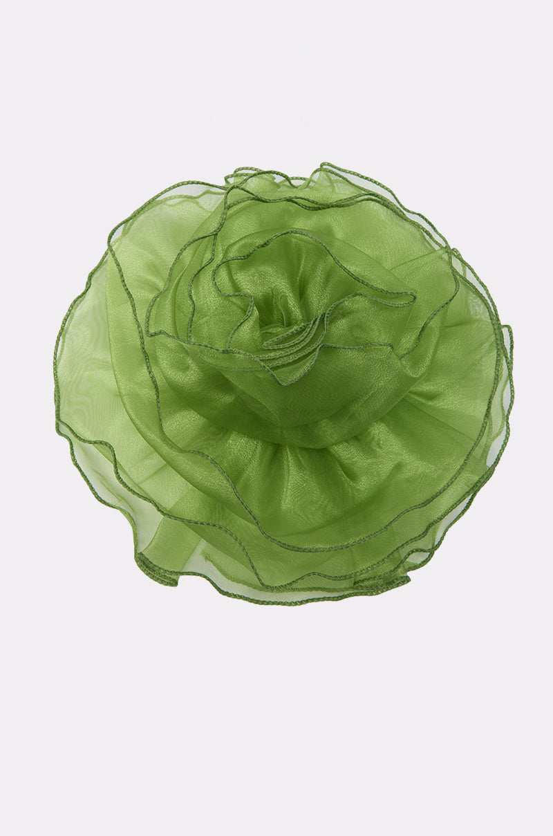 The NO ENVY BROOCH is an oversized decorative green organza flower with layered, translucent petals arranged in a circular shape, creating a striking satiny accessory set against a plain white background. 3