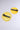 The LIFE GIVES YOU LEMONS HAIR CLIP SET includes two barrette-style clips: one shaped like a lemon slice and the other a solid yellow circle, both with black metal fasteners on a light gray background.
