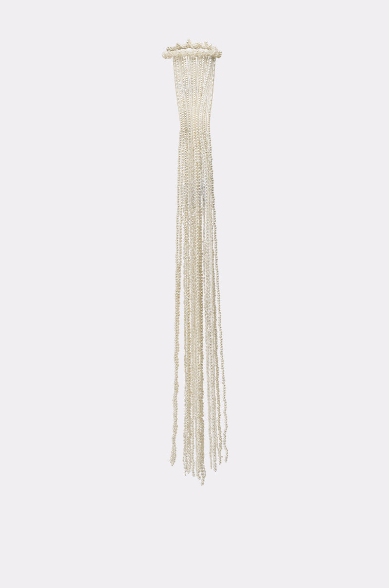 The PURE VIBES PEARL HAIR ACCESSORY features multiple thin strands of small white pearls, cascading delicately like mermaid-core jewelry against a simple background. 3