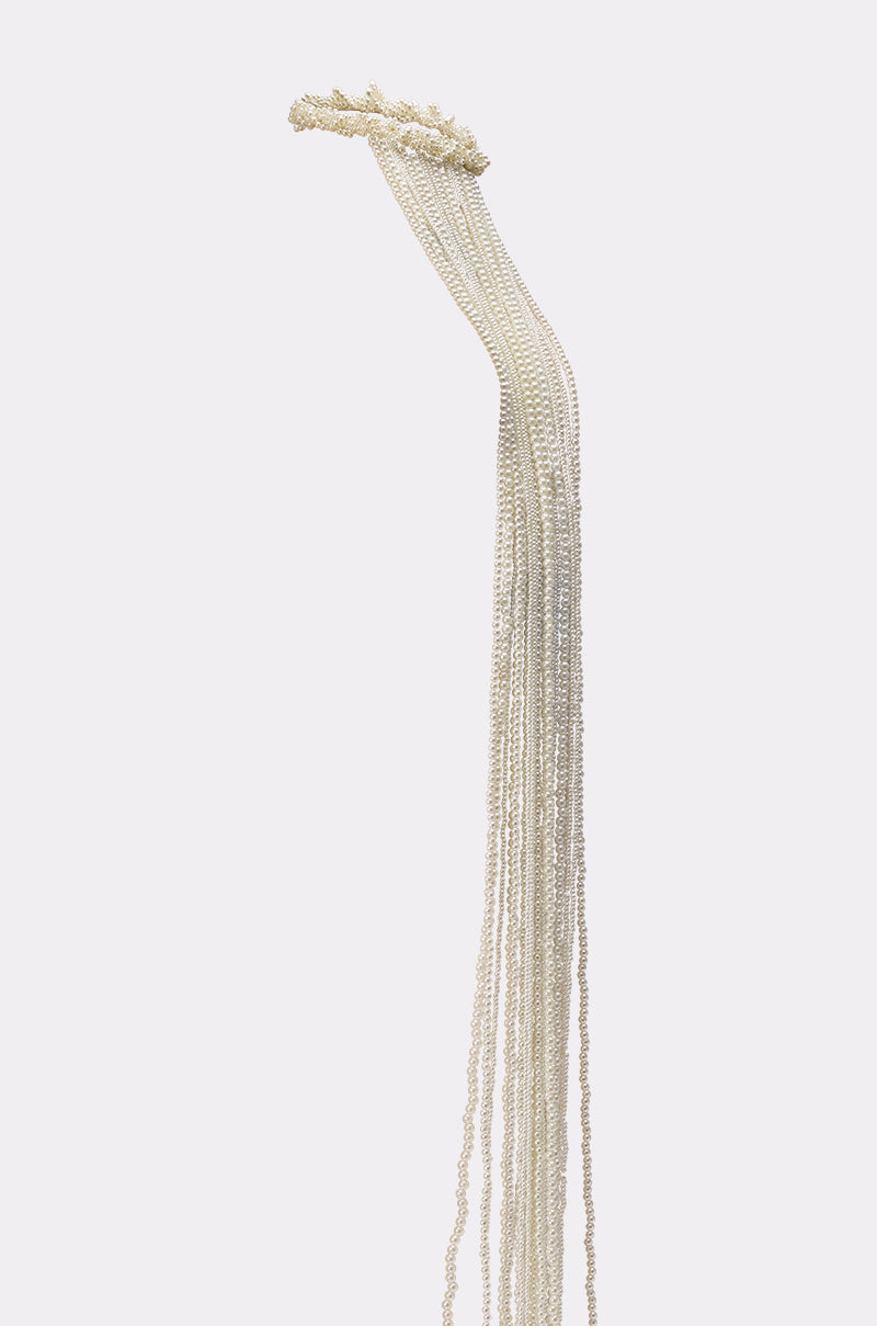 PURE VIBES PEARL HAIR ACCESSORY features long, delicate pearl strands hanging vertically against a plain white background, evoking an elegant mermaid-core vibe—perfect as a stylish hair tie or statement accessory. 5