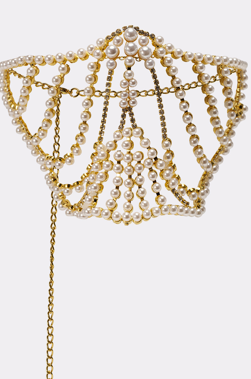 The DONT TALK PEARL MOUTHPIECE features a gold headpiece with strands of white pearls and crystals, draping in an intricate crown pattern with a hanging chain—ideal for festivals or styling with a pearl rhinestone mask. 3