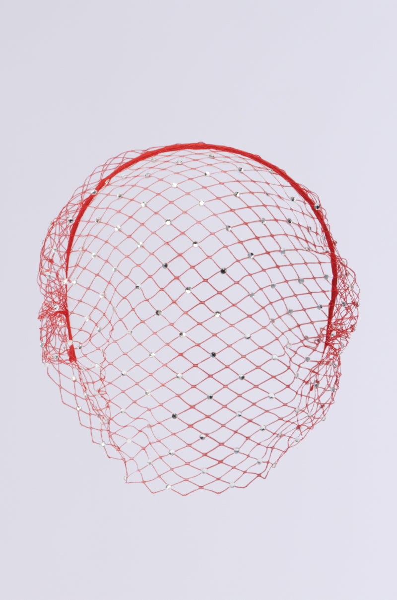 The I SEE FIRE RHINESTONE HEADBAND from the AKIRA Label is a red fascinator with small silver beads. It features a netted, airy design that forms a rounded structure, perfect for wearing on the head. The background is white. 3