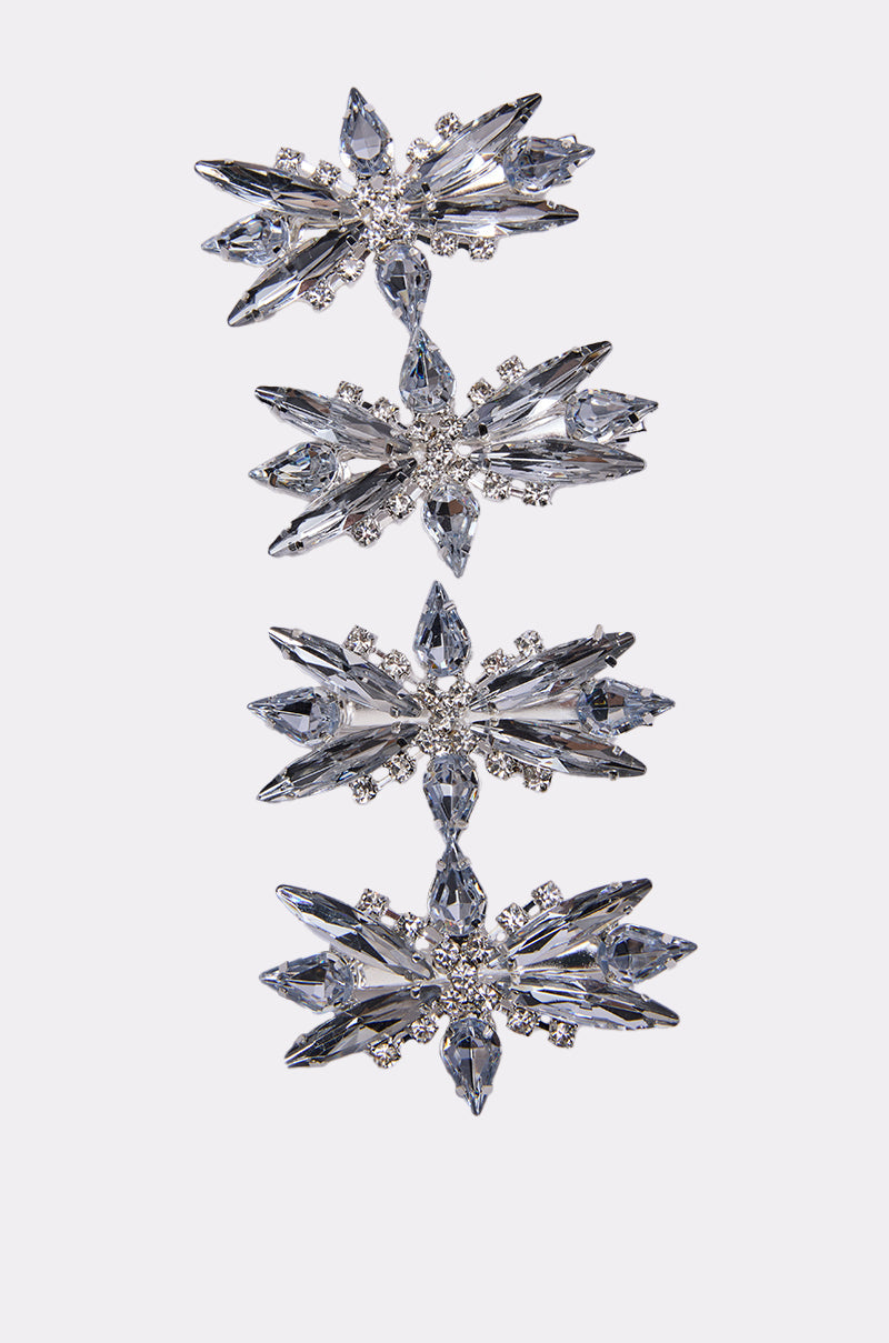 The DECO RHINESTONE 4 PK CLIPS features four connected, silver-tone star-shaped hair clips with clear rhinestones and round crystal accents, displayed vertically on a plain white background. 1