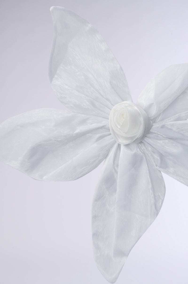 The FLOWER BLOOM BROOCH features a decorative white chiffon rosebud with four large petals and a rolled center, arranged in a flower shape and displayed against a plain light background. 3