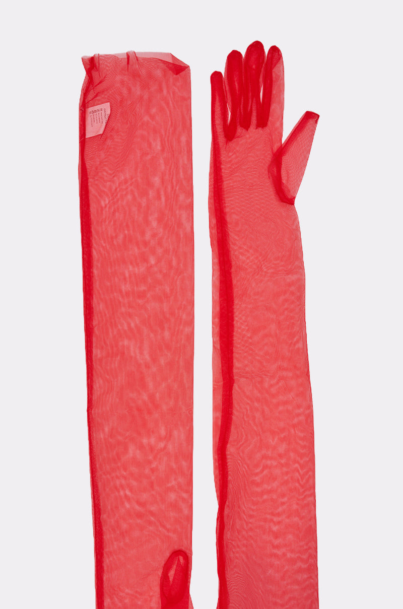The TRINA MESH GLOVES, a sheer red statement glove set, is displayed on a light background with one upper-arm length glove laid flat and the other positioned to show the fingers. 6