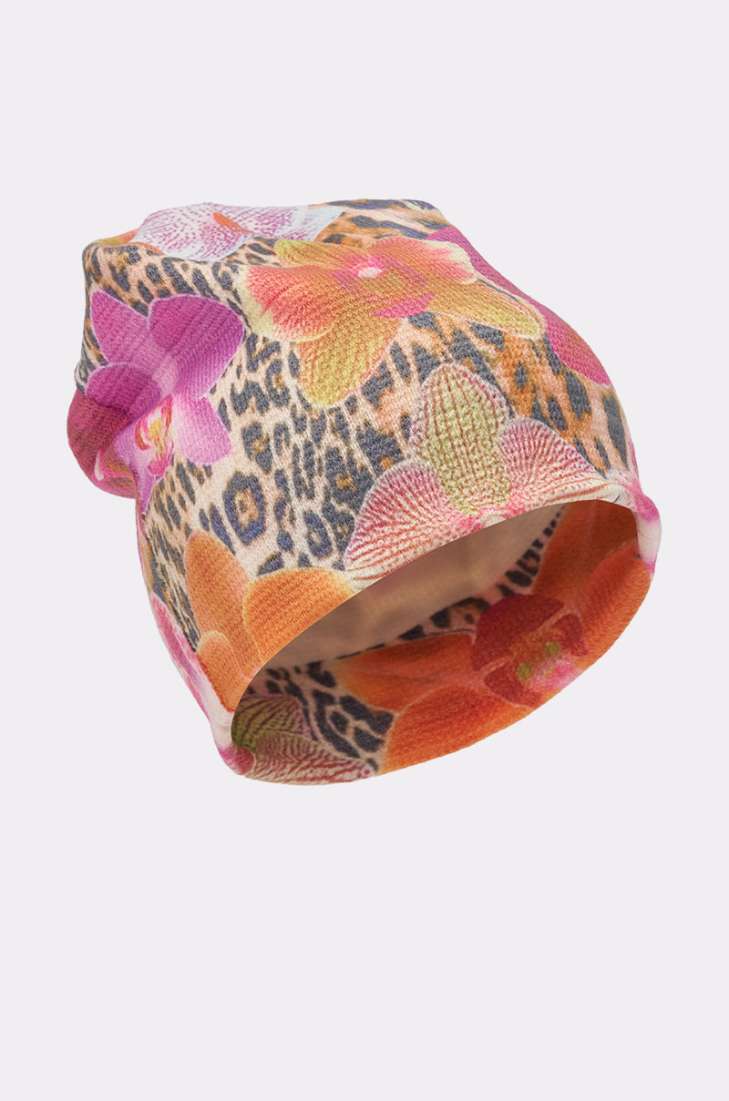 The WILDLY FEMME LIGHTWEIGHT BEANIE showcases vibrant orange, pink, and purple floral leopard prints on white—a standout accessory to elevate your street style. 4