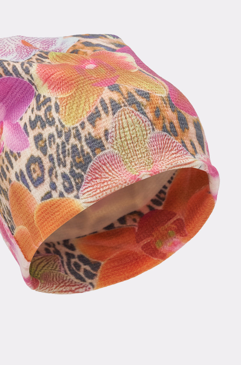 The WILDLY FEMME LIGHTWEIGHT BEANIE features a soft fleece with vibrant orange, pink, and green floral prints over a brown and black leopard pattern—perfect for adding bold street style to any look. 5