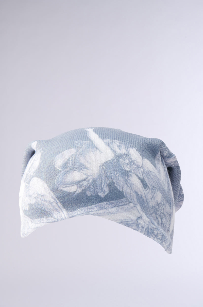 The CITY OF ANGELS PRINTED BEANIE is a light gray and white beanie featuring a detailed classical angel graphic with wings on a gradient background. Made from stretchy fabric, it combines chic comfort with timeless style. 3