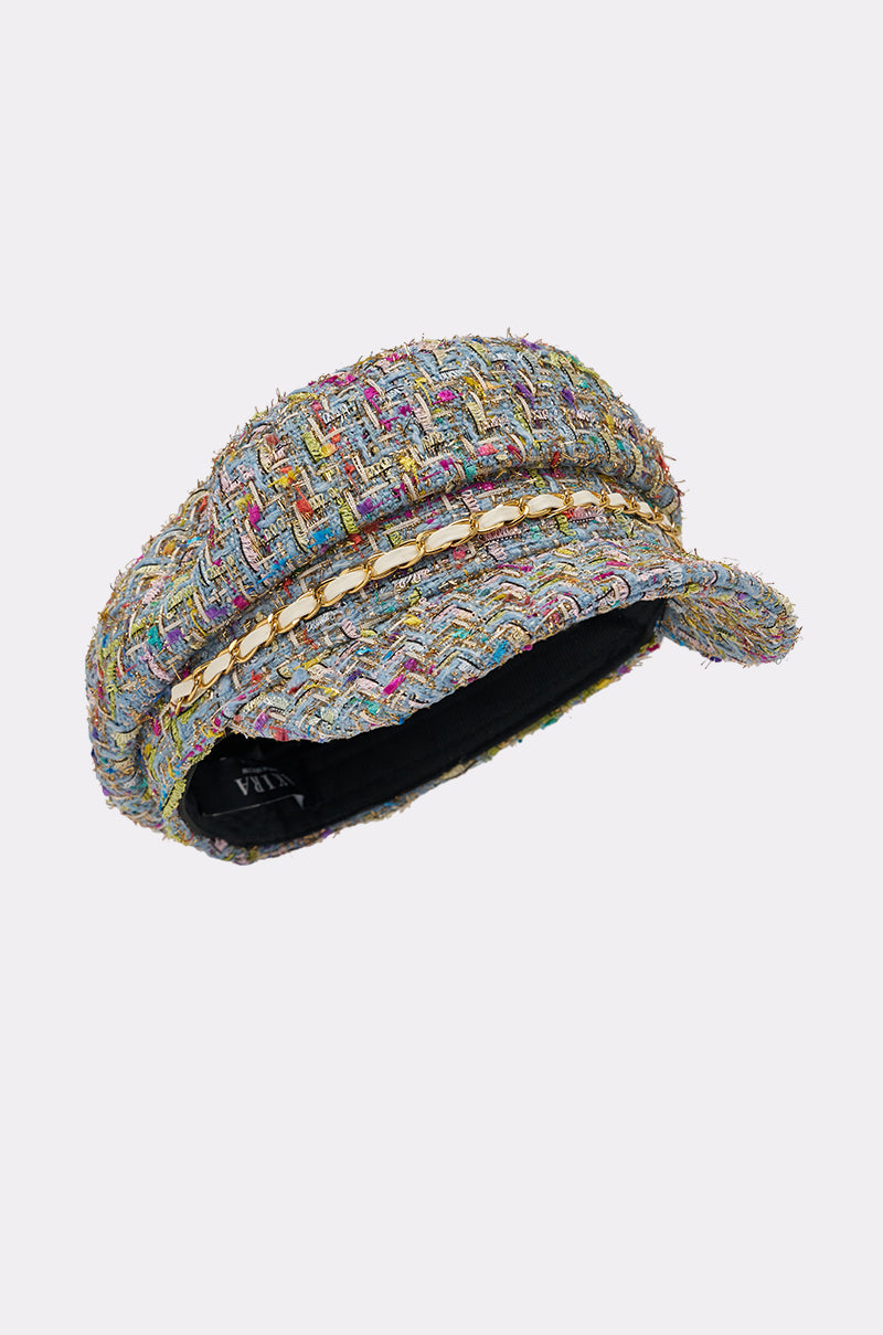 The I HAVE CLASS TWEED BRIM HAT is a chic multicolor newsboy cap featuring a short brim and an elegant gold chain trim, shown on a plain light background. 3