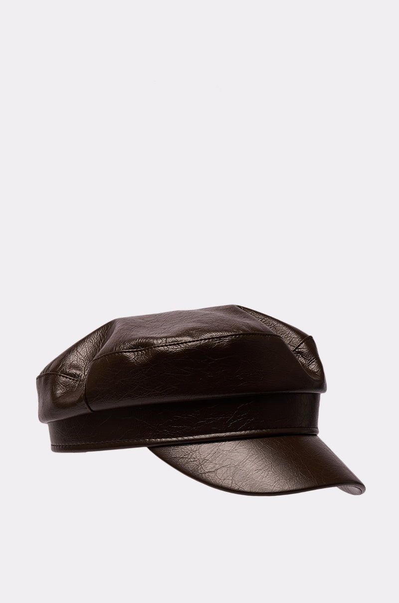The LIKE BUTTER PU BRIM HAT is a dark brown faux leather baker boy hat with a short, stiff brim, shown against a plain light grey background. 3