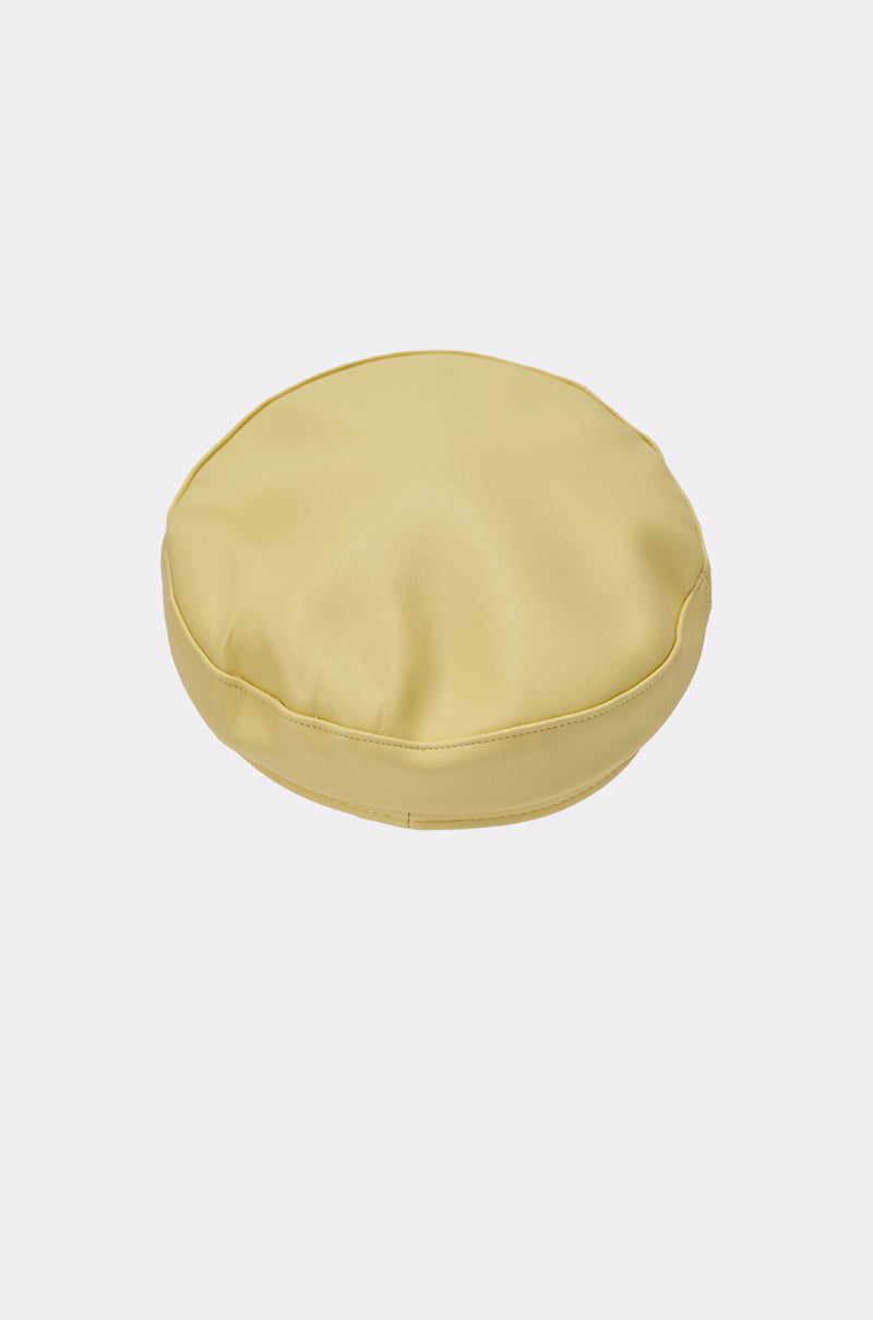 The BUTTER ME UP PU BRIM HAT, in a smooth butter yellow finish, is stylishly displayed on a plain white background. 5