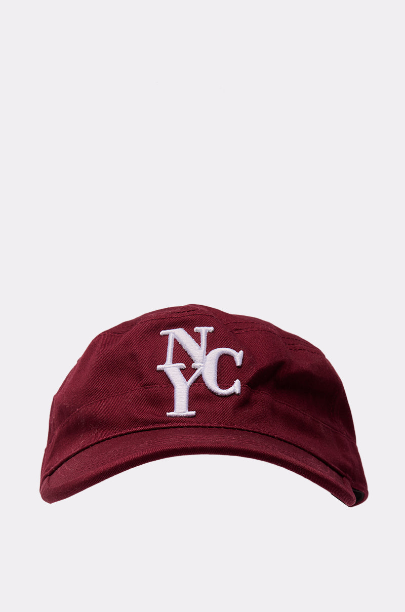 The CITY GURL HAT is a burgundy cap with white embroidered "NYC" on the front, shown on a plain light gray background. It features an adjustable strap for a comfortable fit. 2