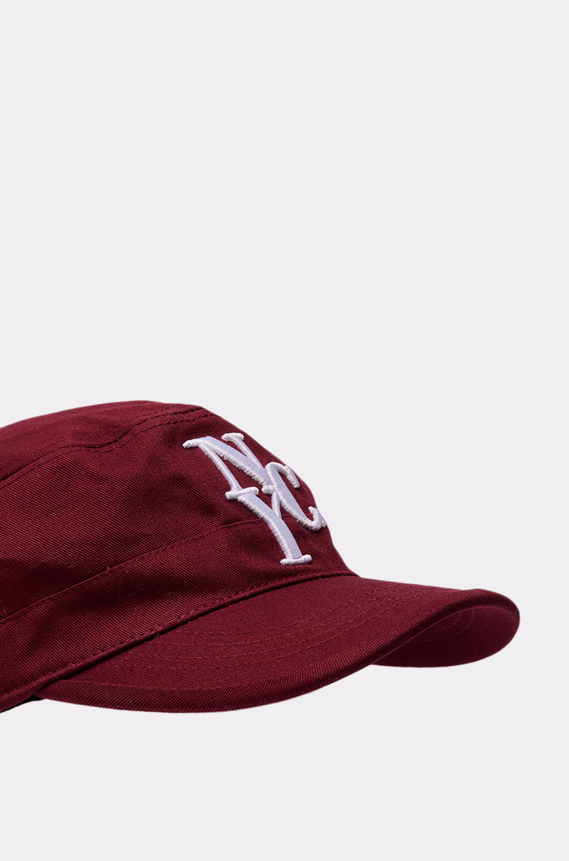 The CITY GURL HAT is a burgundy cap with a white embroidered "NY" logo on the front, shown against a plain light gray background. 4