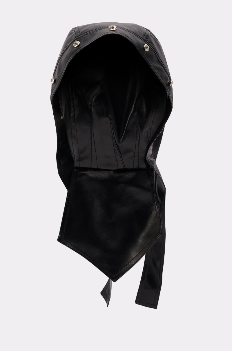 The CASEY PU TIE SKULL CAP is a black faux leather hood featuring visible stitching, metal snap buttons along the edge, and an extended flap at the front. Displayed against a plain light background.