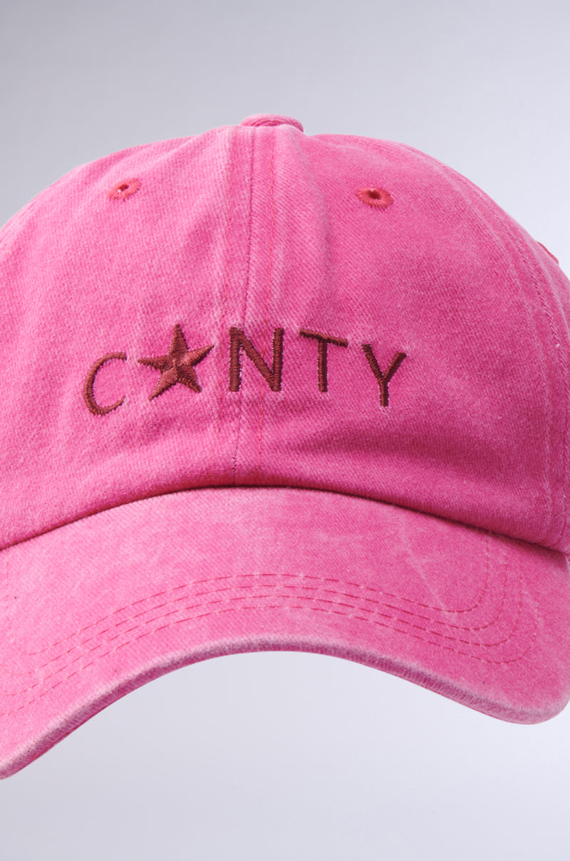 A vibrant pink "I SAID WHAT I SAID HAT" featuring "C*NTY" embroidered on the front in brown thread, with a star symbol replacing the letter "U.