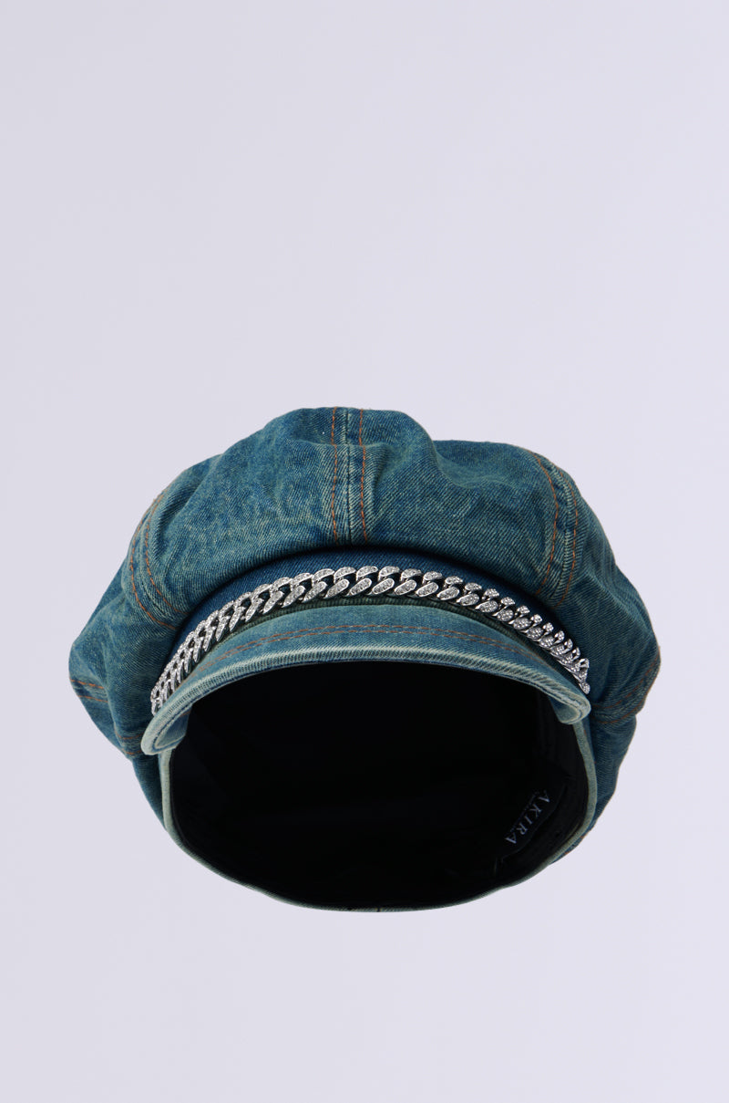 The DENIM BLUES BRIM HAT, a blue denim beret featuring a rhinestone-embellished chain detail around the brim, is showcased against a plain white background. 3