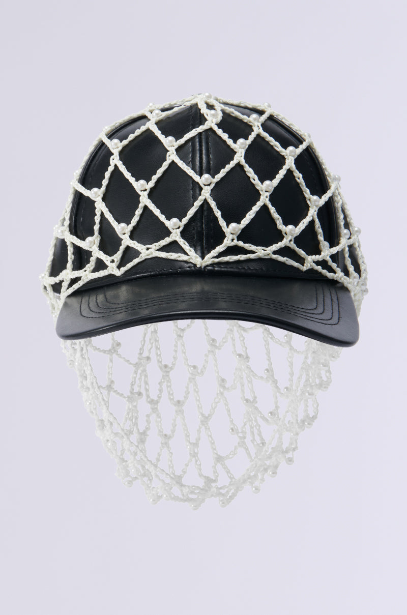 The "CATCH ME IF YOU CAN HAT" is a black baseball cap adorned with a decorative white rope fishnet overlay that drapes elegantly below the brim, featuring intricate knot details against a simple white background. 2