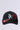 Introducing the BIG CITY BROOCH TRUCKER HAT: a black cap featuring 