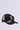 The BIG CITY BROOCH TRUCKER HAT is a black trucker cap with 