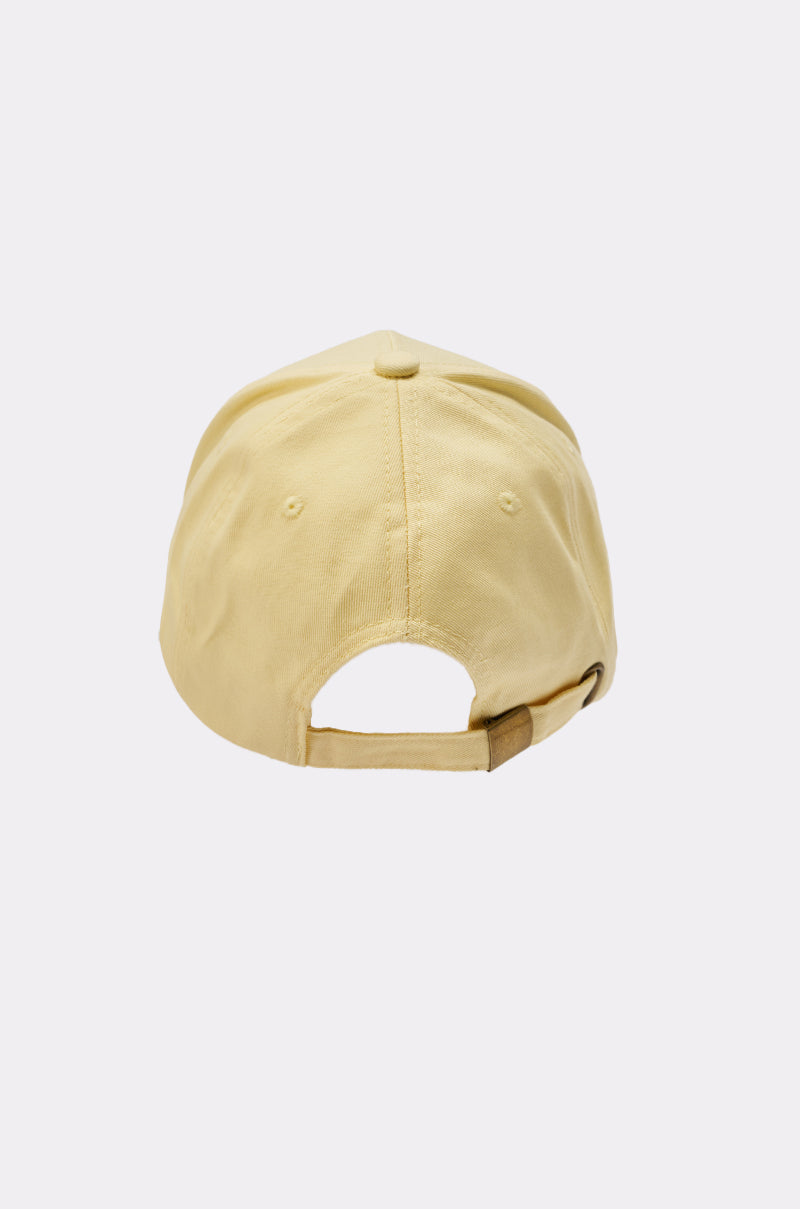 The IN THE SUN BLING HAT is a light yellow adjustable baseball cap shown from the back, featuring an adjustable strap with a metal buckle, curved crown, and visible stitching—perfect for casual streetwear looks. 6