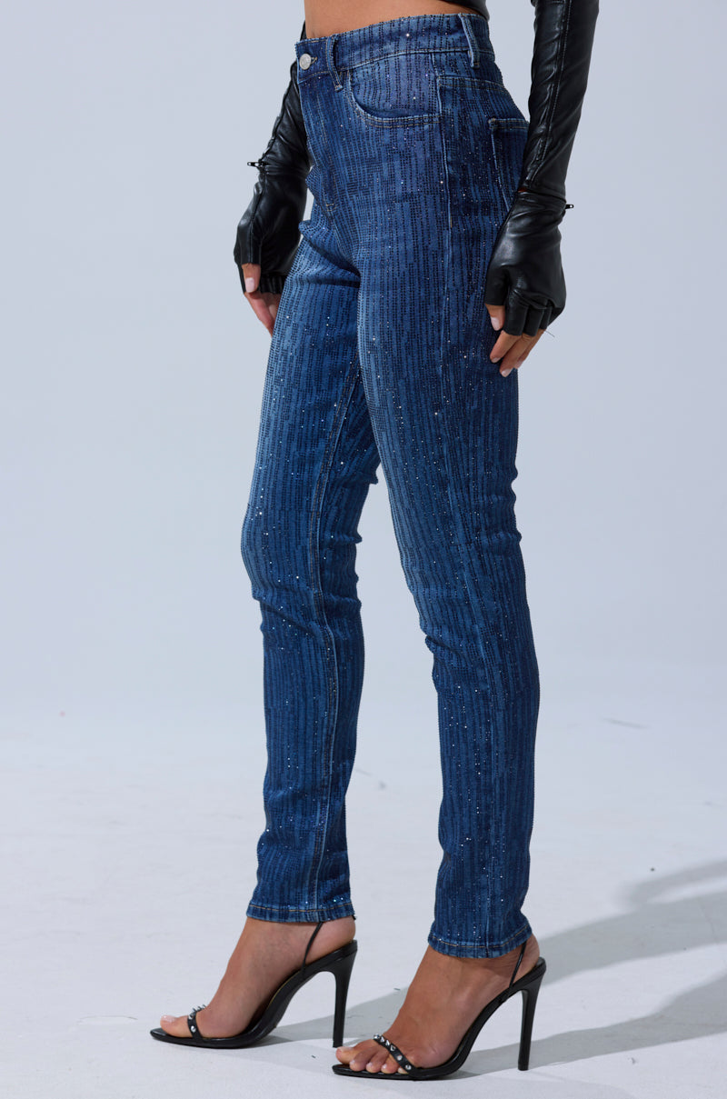Wearing SHINING STAR RHINESTONE WIDE LEG PANT, black heeled sandals, and long black gloves, a person stands against a plain gray background.