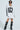 A person exudes cool confidence in the white oversized silhouette of the 
