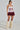 A model wears a sporty crop top with 