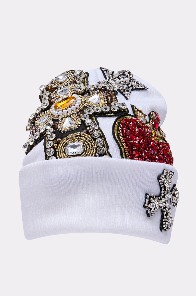 The NO ONE ELSE LIKE ME BEANIE features jeweled cross designs, a striking red beaded heart, and shimmering rhinestone accents—an eye-catching accessory for bold statement makers. 3