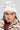 A person sporting the ASAP Vibes Embellished Beanie from the AKIRA Label and a leopard print faux fur coat radiates iconic vibes. They accessorize with hoop earrings and enhance their look with bold makeup—eyeliner and blush—as they pose against a plain background.