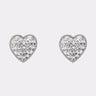 The ALL MY HEART EARRING IN SILVER features sparkling, heart-shaped rhinestone studs with clear faceted stones—an ideal bridal accessory displayed on a plain white background.
