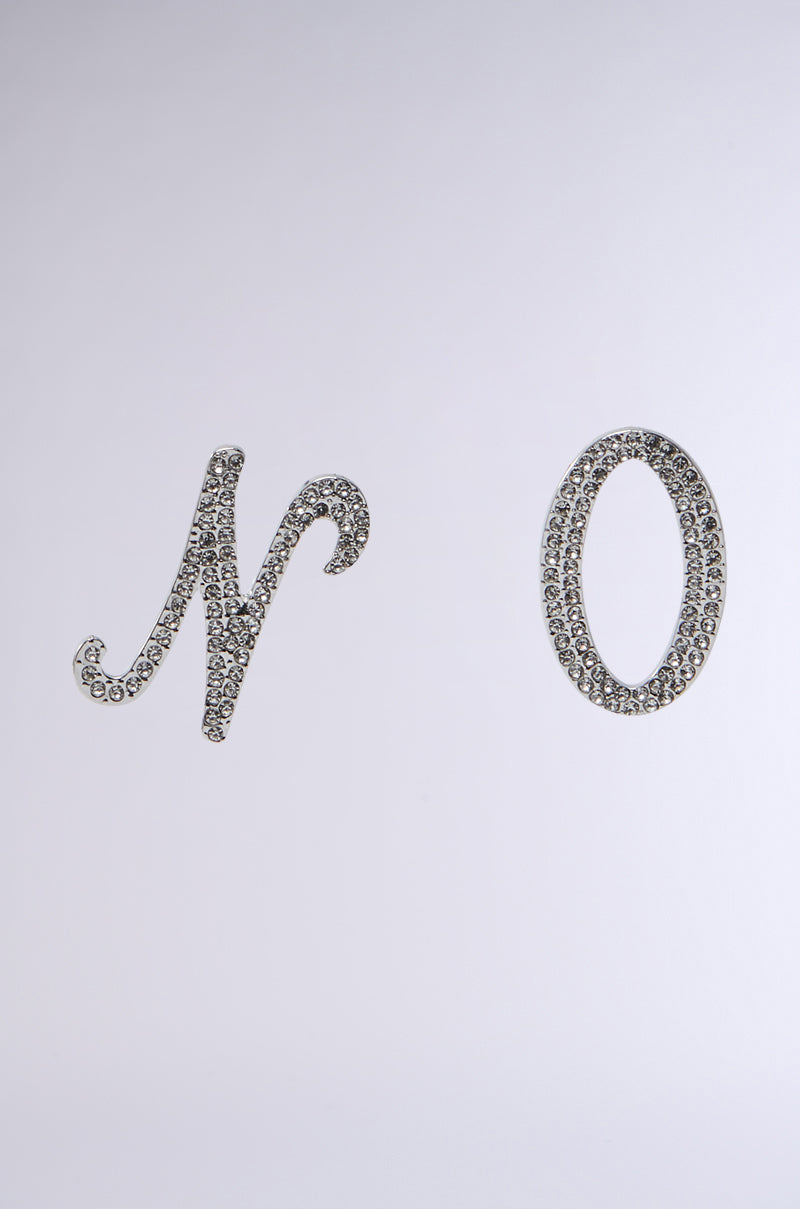 The image features the NO THX EARRING, displaying the word "No" in elegant cursive script embellished with shimmering rhinestones that glisten like faux silver metallic against a plain, light background. 3