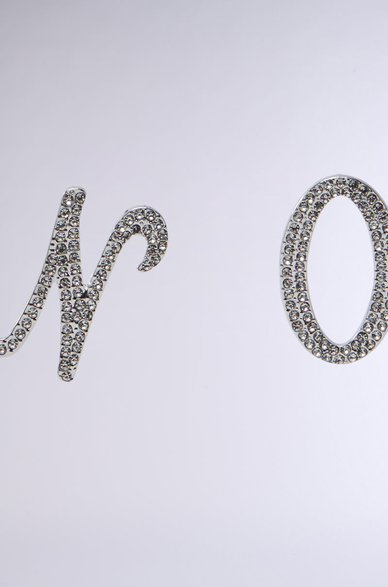 The image features the NO THX EARRING, displaying "No" in elegant cursive with faux silver metallic and rhinestone accents on a plain background. 4
