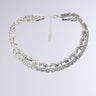 The BLING RING NECKLACE IN SILVER features two rows of square and round clear rhinestones, creating a sparkling faux silver bling look, displayed on a plain light gray background.