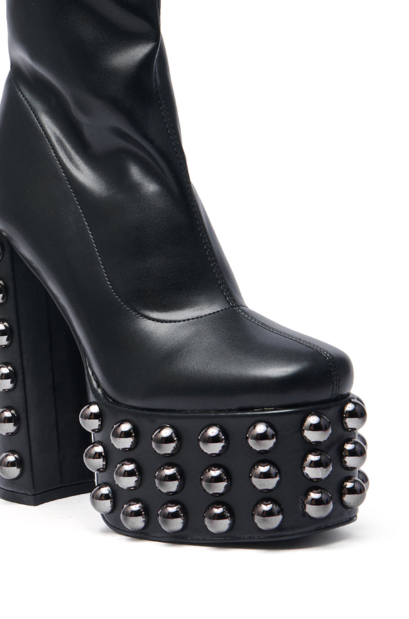 The AZALEA WANG AKITO BLACK GUN METAL STUDDED PLATFORM BOOTIE features a thick platform sole, crafted from black faux leather with metallic gun metal studs embellishing the front and sides.