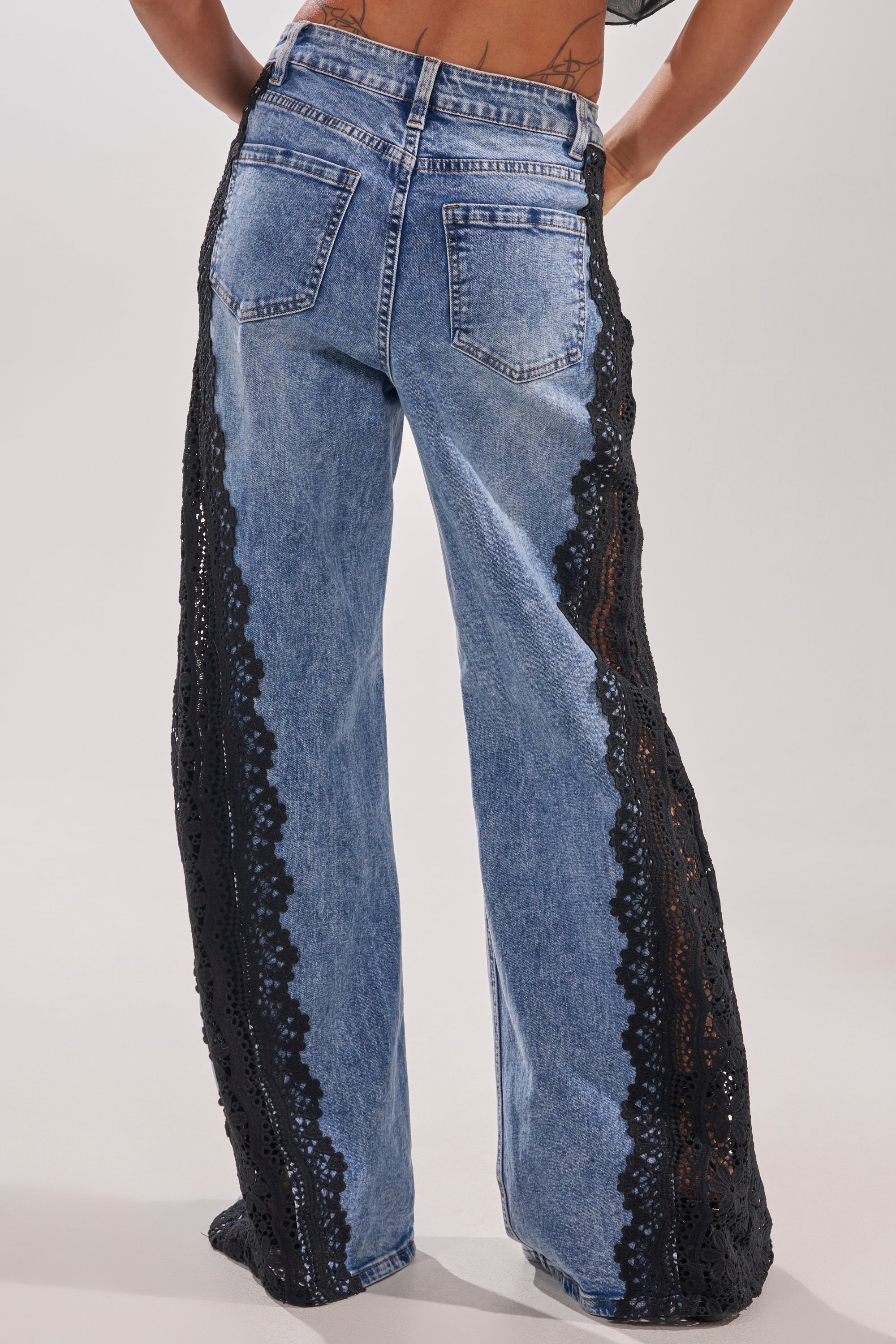 Elevate your style with the LOCKED IN LACE DENIM, wide-leg jeans featuring delicate black lace trim for a chic finish. 3