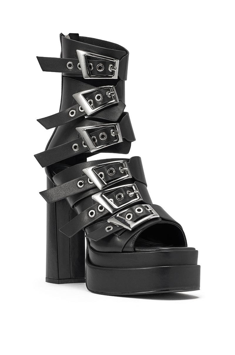 The AKIRA GOLD ALBERIC BLACK CHUNKY PLATFORM SANDAL is a black faux leather platform with a block heel, featuring multiple wide straps and bold silver buckles for an edgy look. 3