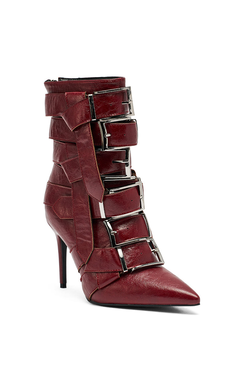 The AZALEA WANG ALCETAS Red Stiletto Bootie features a pointed toe, multiple wide straps with large silver buckles up the front, and is crafted from sleek faux leather for a bold, modern style. 4