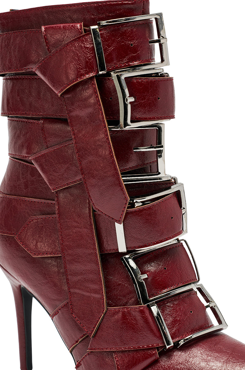 The AZALEA WANG ALCETAS RED STILETTO BOOTIE WITH BUCKLES features deep red faux leather, wide straps, and bold silver buckles—perfect ankle boots for making a stylish statement. 6