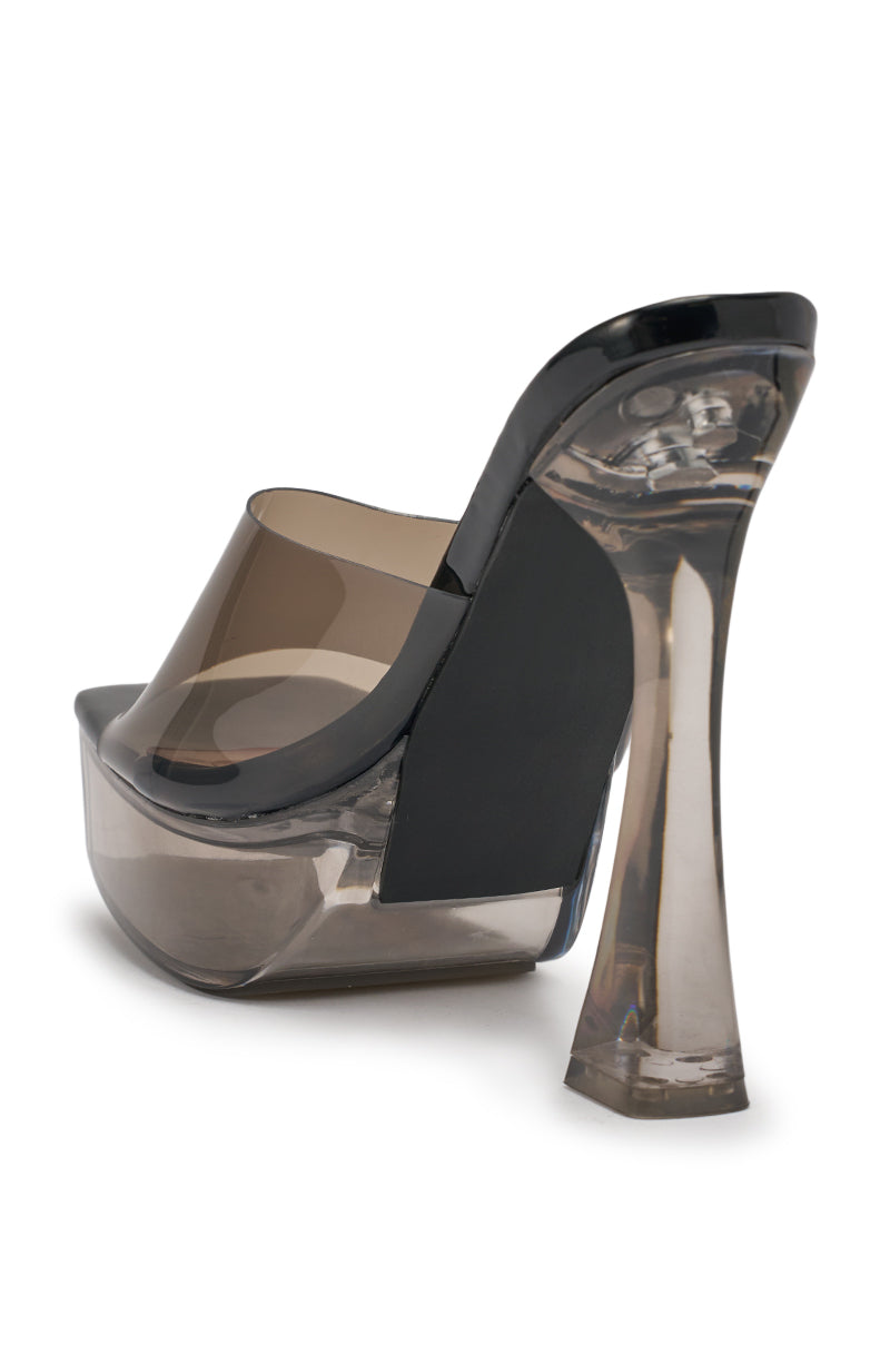 The AKIRA ALEXUS SMOKE PVC CHUNKY SLIP ON SANDAL features a high platform sole, chunky transparent heel, smoky translucent PVC upper, and an open back mule design. 9