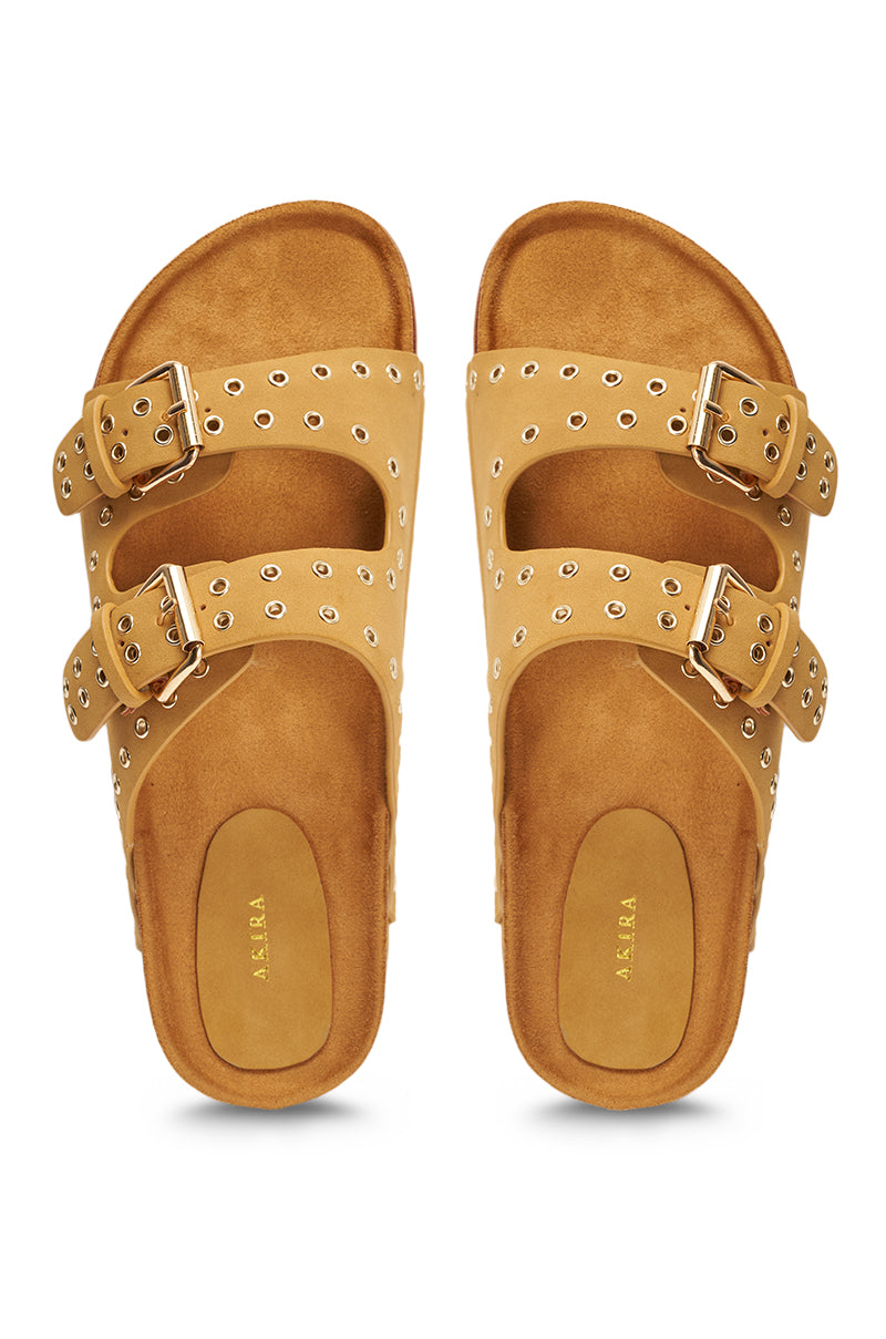 The AZALEA WANG ALGEDI TAN PLATFORM SANDAL features tan grommet-detailed sandals with two wide studded straps, adjustable silver buckles, cushioned chunky platform footbeds, and gold “ASRA” stamped insoles. 3