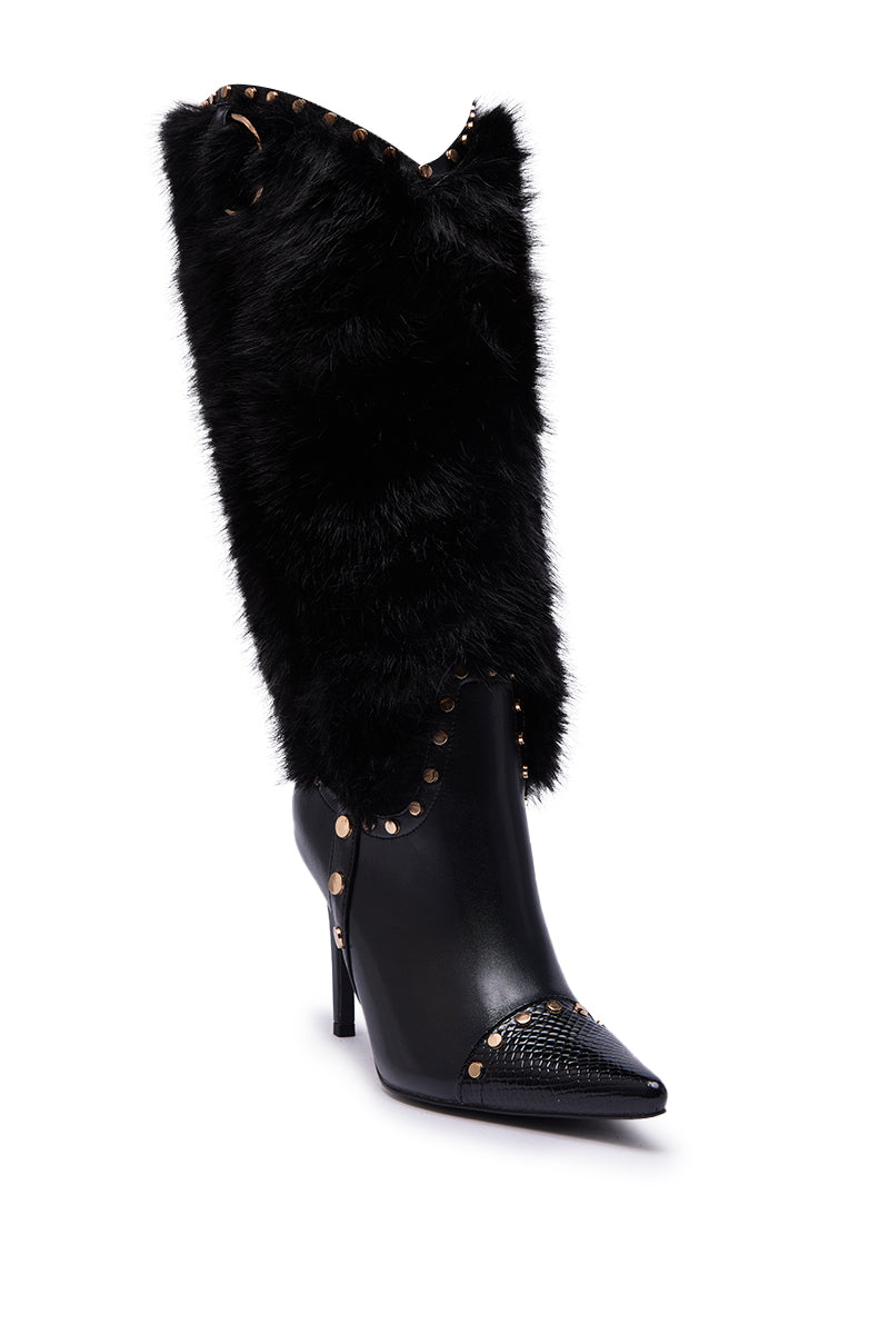 The AZALEA WANG ALISETTE BLACK FUR BOOT features plush black faux fur, a pointed toe, gold studded seams, textured details, and a stiletto heel for a bold, statement knee-high look in sleek faux leather.