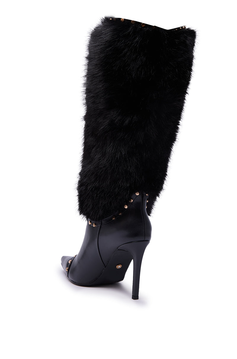 The AZALEA WANG ALISETTE BLACK FUR BOOT features a black pointed toe, stiletto heel, and faux fur shaft adorned with metallic studs, bringing a dramatic flair to these chic faux leather knee-high boots.