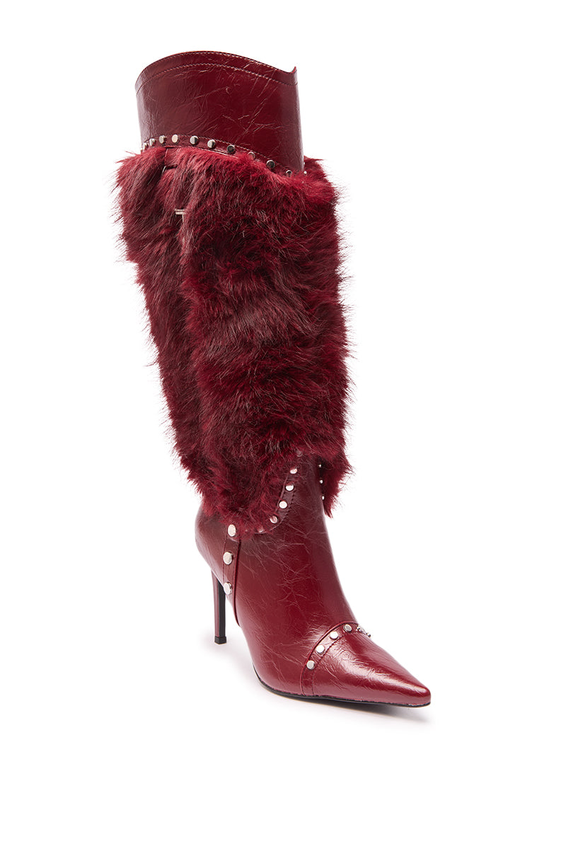 The AZALEA WANG ALISETTE Burgundy Mixed Material Fur and Snake Stiletto Boot features a red faux leather pointed toe, faux fur on the front and sides, snake accents, and silver studs at the top, center, and base for a bold knee-high look.