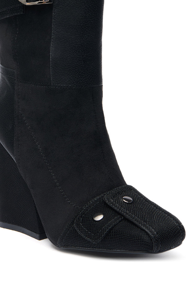 Close-up of the AZALEA WANG ALLONA BLACK CHUNKY BOOTIE in faux suede, featuring a pointed toe, textured decorative flap with two metal studs, a block heel, and visible stitching for added detail.