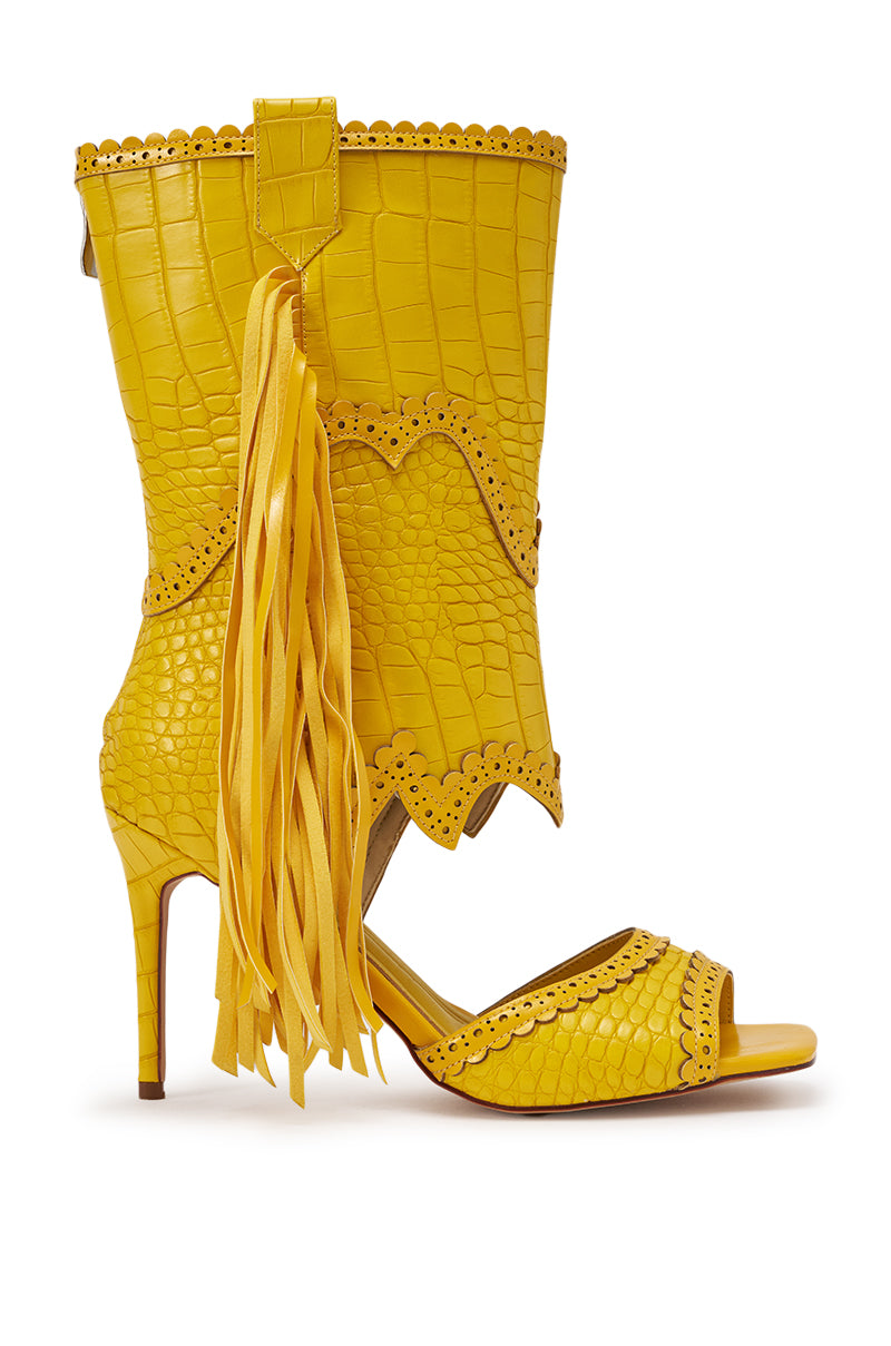 The AZALEA WANG ALPHONSE YELLOW OPEN TOE SANDAL is a mid-calf, croc-embossed faux leather boot with scalloped edges, bold fringe, an open toe, and a western-inspired design. 4