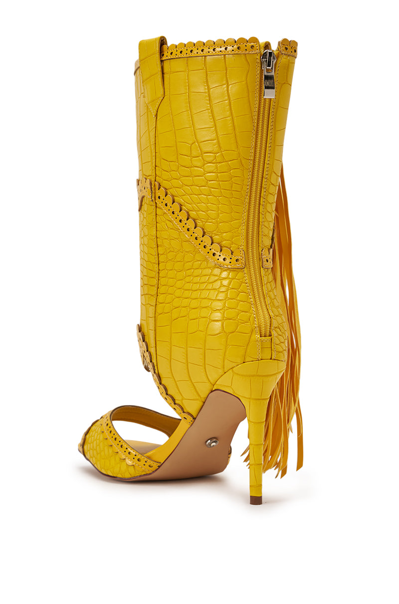 The AZALEA WANG ALPHONSE YELLOW OPEN TOE SANDAL features yellow faux leather with a crocodile texture, tall boot shaft, side zipper, decorative trim, and boho-chic fringe at the back for a unique look. 6