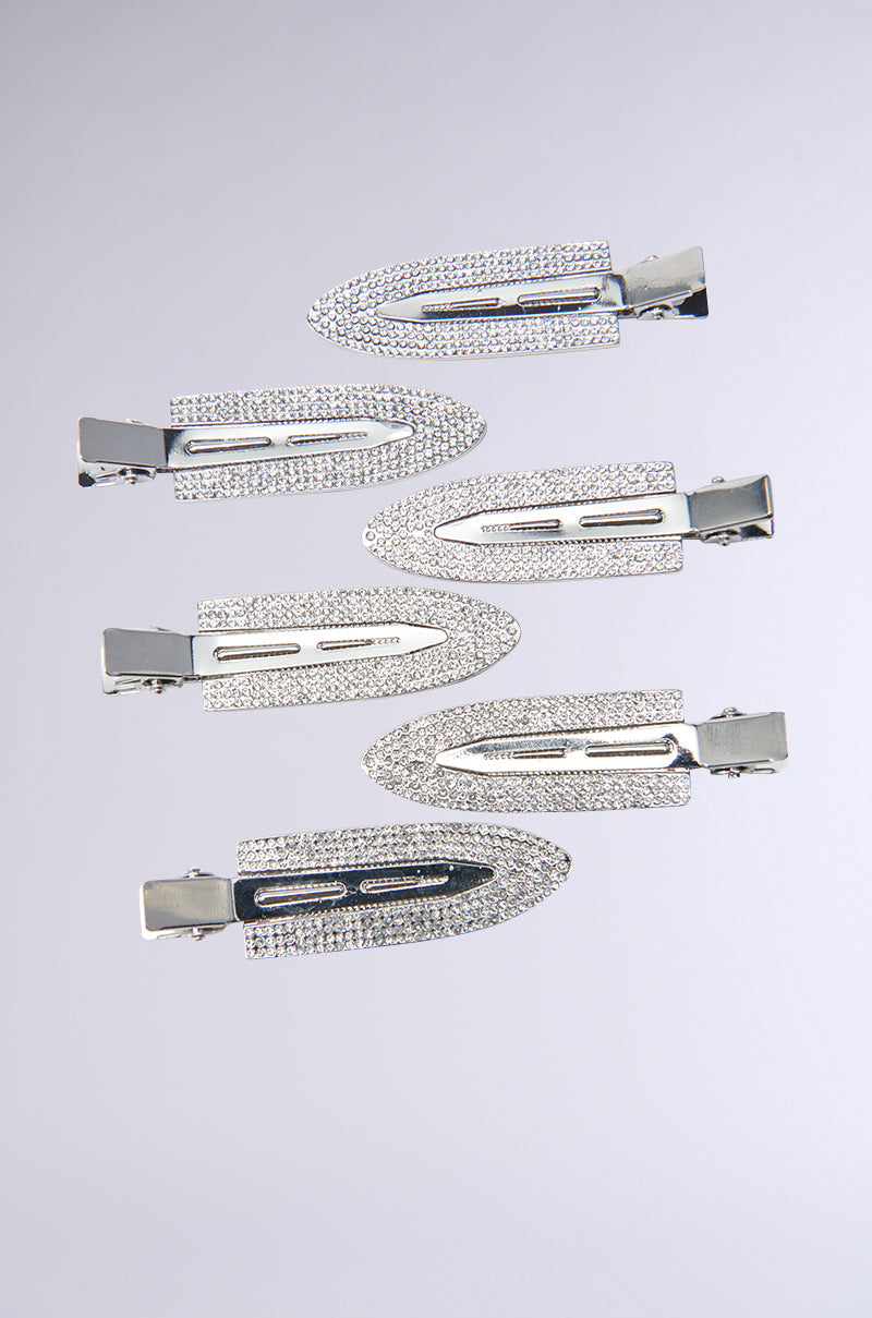 Six TOO PRETTY FOR THIS BLING HAIR CLIPS, featuring silver sequins and rhinestone embellishments, are displayed in two parallel rows against a plain gray background. These clips boast a sleek, shiny finish and a pointed design reminiscent of elegant arrows. 4